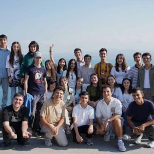 Group of Maqoor Eco Camp participants gathered on the shore of Lake Sevan, Armenia for an outdoor environmental workshop